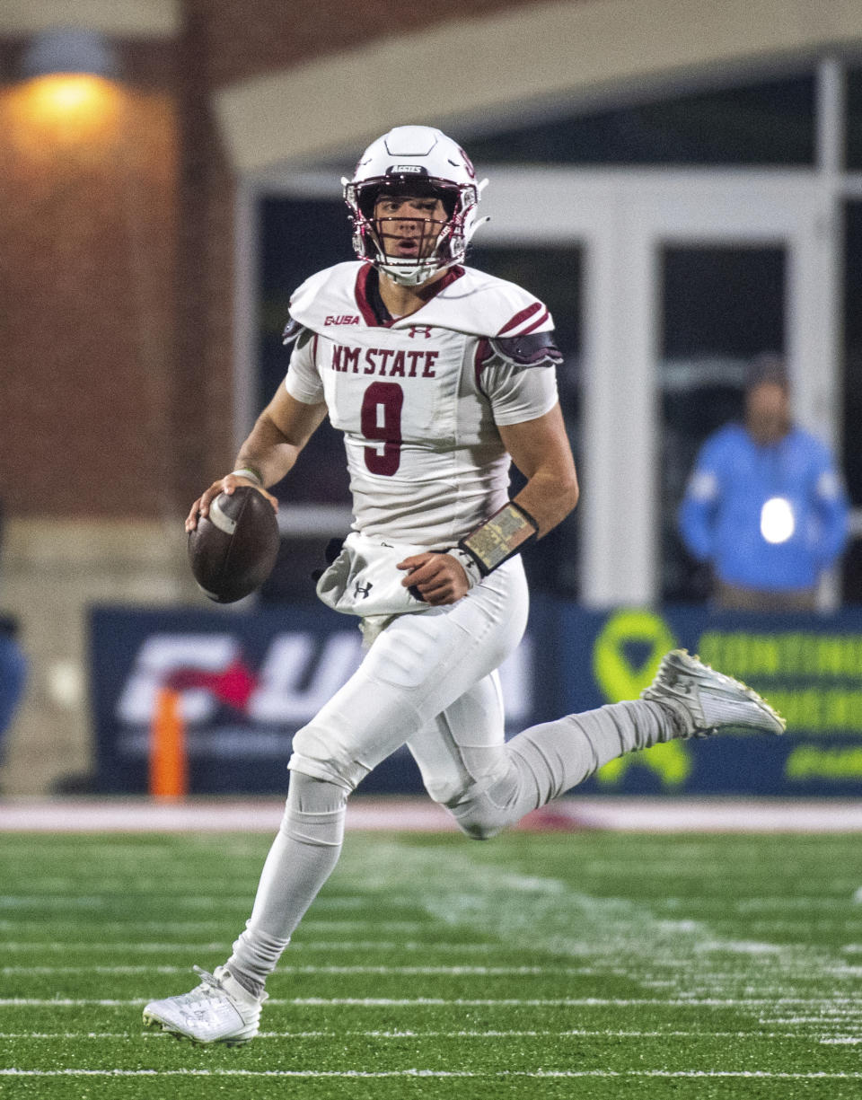 New Mexico State's Blaze Berlowitz looks downfield during the second half of the team's Conference USA championship NCAA college football game against Liberty, Friday, Dec. 1, 2023, in Lynchburg, Va. (AP Photo/Robert Simmons)