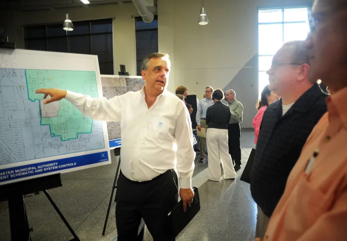 Tim Hagey, left, general manager of Warminster Municipal Authority, speaks with residents during a public information session about water quality in Warminster. The meeting followed the announcement that public and private wells in Warminster (and nearby Horsham) were contaminated by two chemicals used when the Navy was operating the Naval Air Warfare Center.