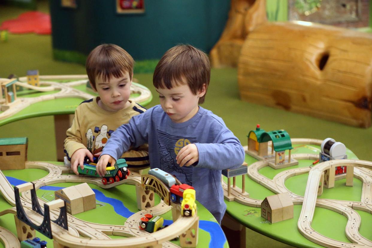 Sam Grady, left, and his twin brother Ben, 3, from Epping explore the trains and tracks at the Children's Museum of New Hampshire in Dover Nov. 15, 2023. The museum is celebrating 40 years.