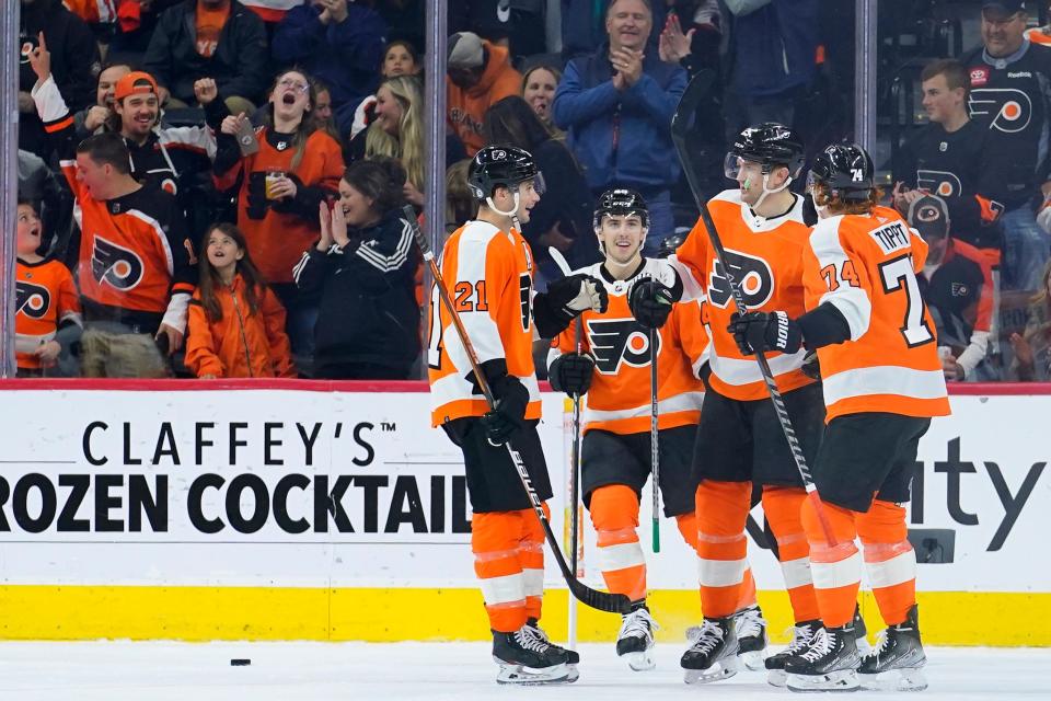 Philadelphia Flyers' Scott Laughton, from left, Morgan Frost, James van Riemsdyk and Owen Tippett celebrate after a goal by van Riemsdyk during the first period of an NHL hockey game against the Ottawa Senators, Friday, April 29, 2022, in Philadelphia. (AP Photo/Matt Slocum)