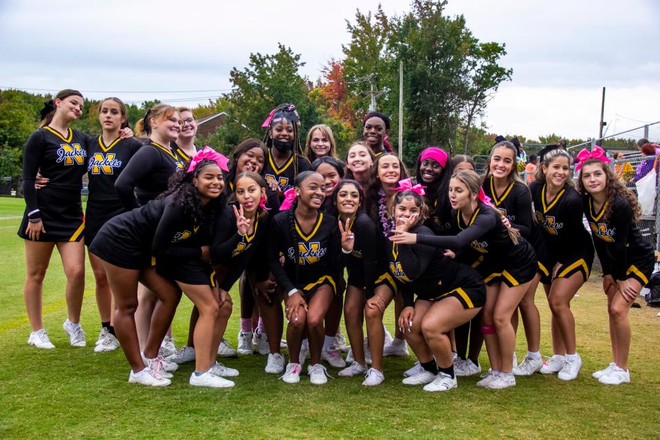 Newark cheerleaders gather before the Yellowjackets' 47-16 homecoming win over McKean.