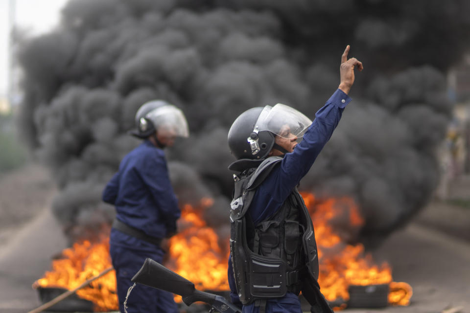 Security forces clash with supporters of presidential candidate Martin Fayulu outside his party's headquarters, in Kinshasa, Democratic Republic of the Congo, Wednesday, Dec. 27, 2023. A main opposition candidate accused police of using live bullets to break up a protest Wednesday in Congo's capital, as demonstrators demanded a re-do for last week's presidential election. (AP Photo/Mosa'ab Elshamy)