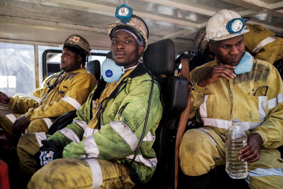 A just transition takes into account a future for coal miners, like these men headed for a South African coal mine. <a href="https://www.gettyimages.com/detail/news-photo/miners-are-seen-aboard-the-transport-leading-them-to-the-news-photo/1244028113" rel="nofollow noopener" target="_blank" data-ylk="slk:Luca Sola/AFP via Getty Images;elm:context_link;itc:0;sec:content-canvas" class="link ">Luca Sola/AFP via Getty Images</a>