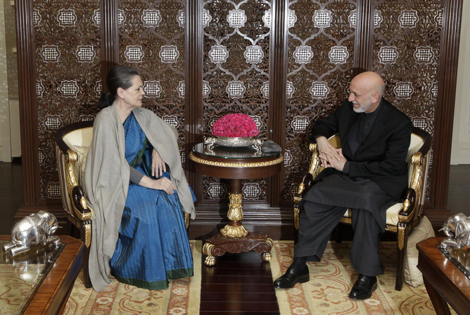 Afghanistan’s President Hamid Karzai, right, talks with ruling United Progressive alliance chairperson and Congress party president Sonia Gandhi, in New Delhi, India, Monday, Nov. 12, 2012. Karzai was meeting with Indian leaders Monday in a bid to woo investment to his war-torn country and boost security before a planned drawdown of NATO troops in 2014. (AP Photo/ Manish Swarup)