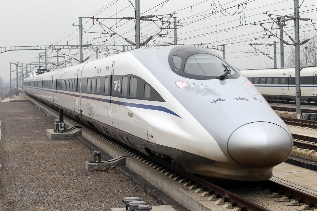 XUCHANG, CHINA - DECEMBER 26:  (CHINA OUT) A CRH high-speed train arrives at Xuchang East Railway Station on December 26, 2012 in Xuchang, China. The world's longest high-speed rail route linking Beijing and Guangzhou started operation on Wednesday. Running at an average speed of 300 kilometers per hour, the 2,298-kilometer new route will cut the travel time between Beijing and Guangzhou from more than 20 hours to around eight.  (Photo by Visual China Group via Getty Images/Visual China Group via Getty Images)