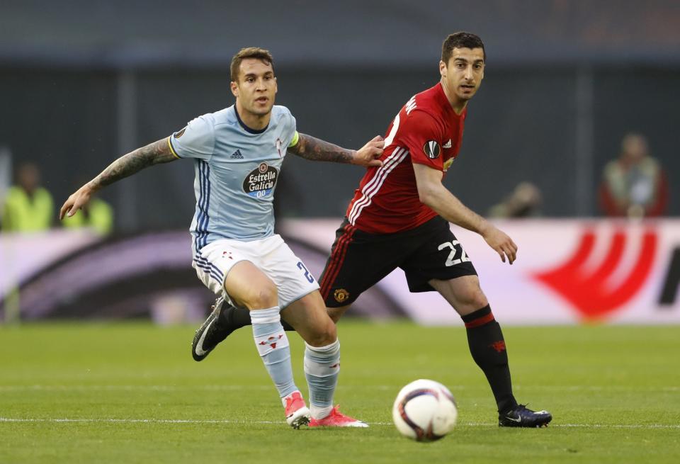 Celta Vigo's Hugo Mallo in action with Manchester United's Henrikh Mkhitaryan