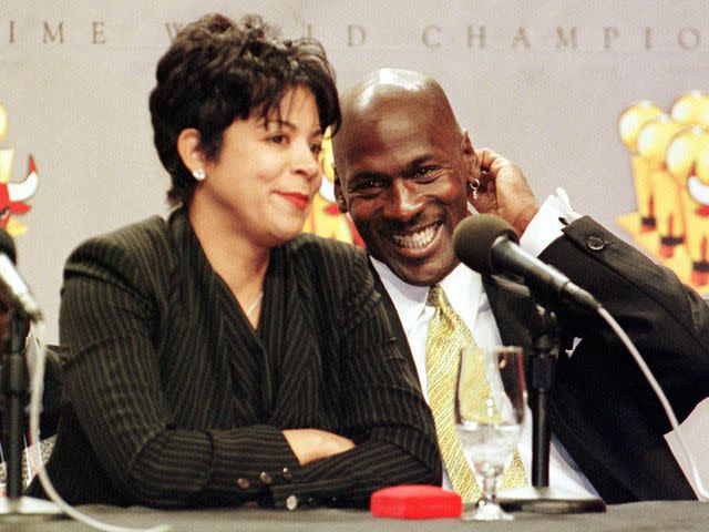 <p>JOHN ZICH/AFP/Getty</p> Michael Jordan and his wife Juanita during a press conference