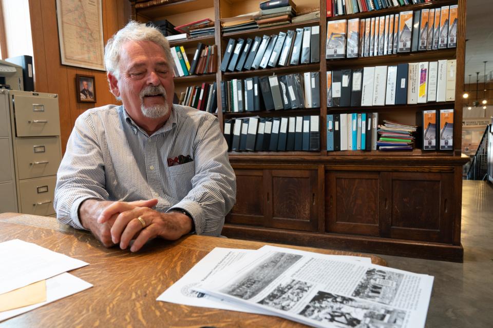 Michael Stubbs, a board member for the Alma-based Wabaunsee County Historical Society, shares information Thursday about the history of native stone fences and the workshops provided to educate people about building and restoring them..