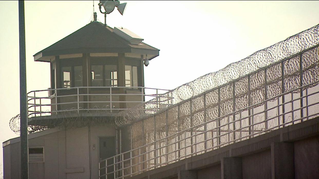 A guard tower looms above barbed wire at the Indiana State Prison in Michigan City. South Bend Tribune File Photo