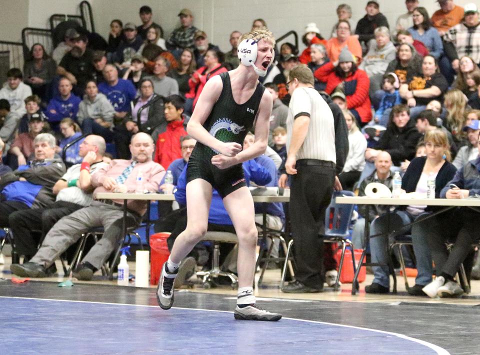 Colchester's Cahota Lafond screams in excitement after winning the 113 pound title at the 2023 State Championships on Saturday night at Vergennes High School.