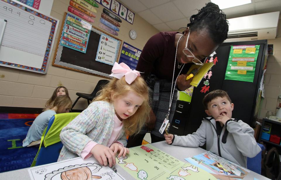 Naomi Boateng works with Finley Ethington and Zion Wagman in their pre-kindergarten class at the Shelby campus of Gaston Christian School Thursday morning, Feb. 2, 2023.