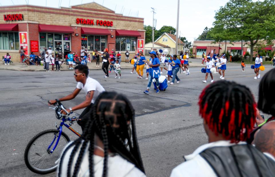 People watch the Juneteenth Day parade and celebration on Saturday, June 19, 2021, in Milwaukee. The celebration is back on King Drive this year.