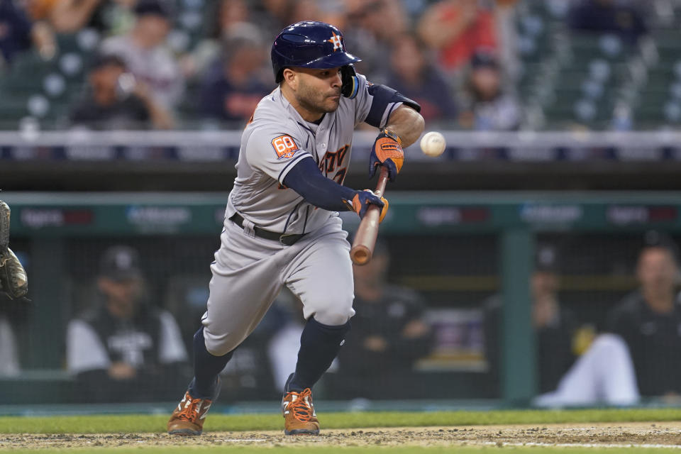 Houston Astros' Jose Altuve bunts for a single in the fourth inning of a baseball game against the Detroit Tigers in Detroit, Tuesday, Sept. 13, 2022. (AP Photo/Paul Sancya)