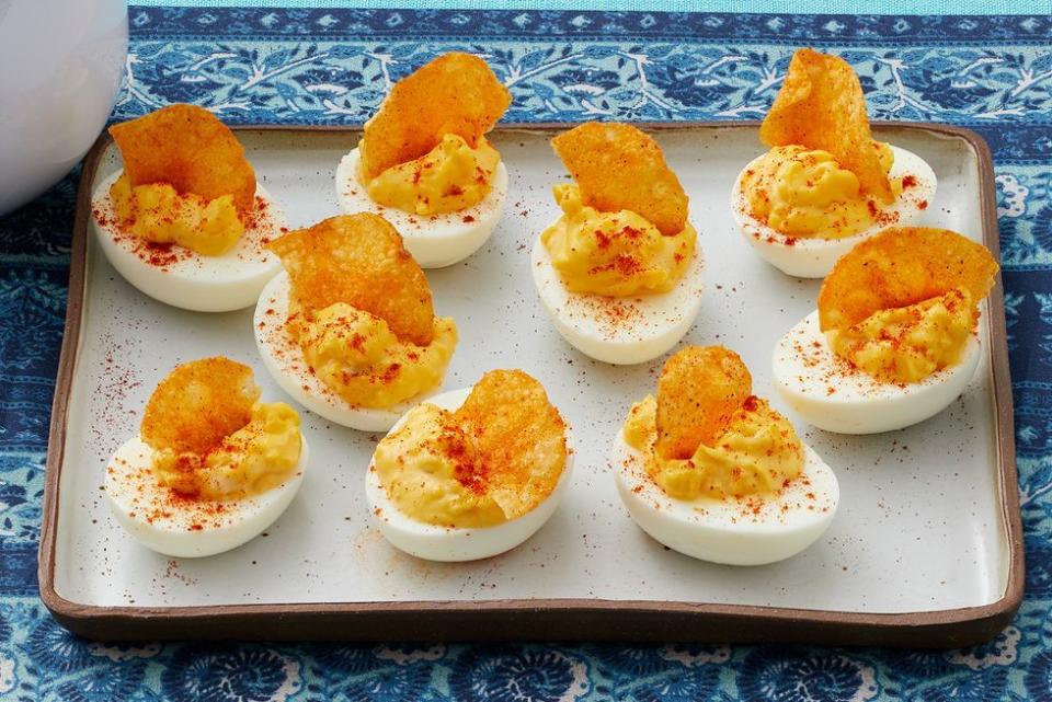 horseradish deviled eggs with potato chips on top