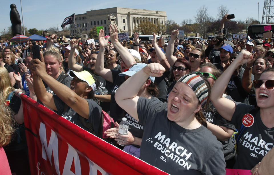 FILE- In this April 10, 2018, Madeline Jacobson, a third grade teacher in Tulsa, protests at the Capitol, in Oklahoma City, Okla. Months after massive teacher walkouts energized many like never before, teachers and their unions are coming to terms with the midterm elections' mix of wins and losses. (AP Photo/Sue Ogrocki, File)