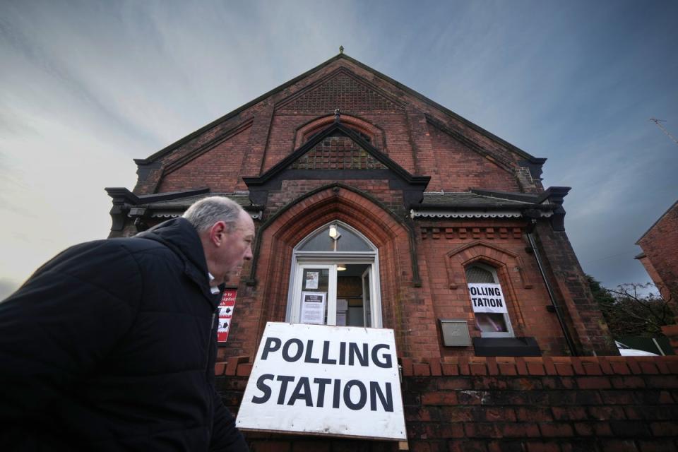 A voter leaves a polling station after voting in the Rochdale by-election on February 29 (Getty Images)