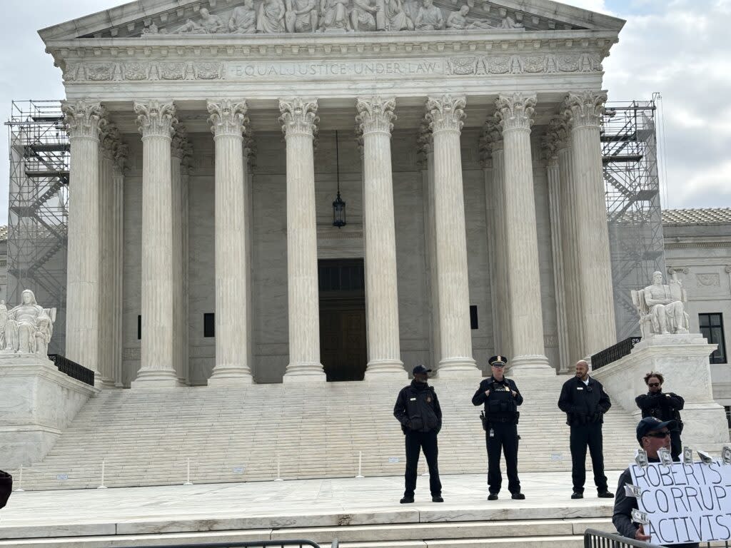 The crowd, as is usual at the U.S. Supreme Court, was kept off the steps by security officers, but people were able to protest below during the oral arguments inside for Trump v. United States on April 25, 2024. (Photo by Jane Norman/States Newsroom)