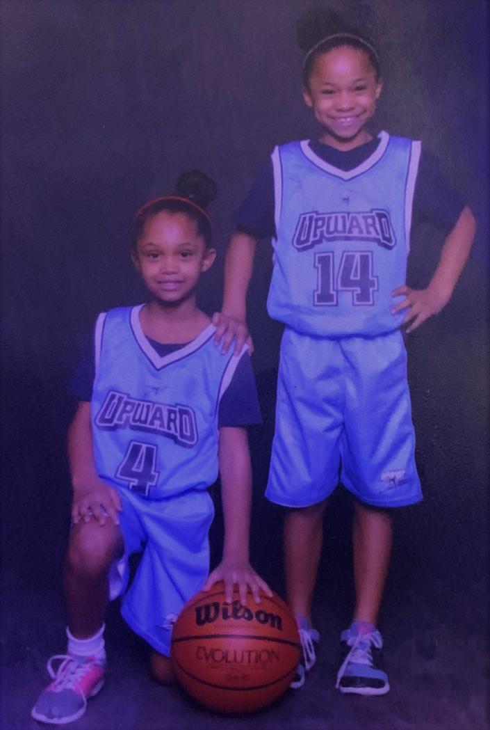 Jaza and Jania Wilson pose for a photo when they were 6 years old and played for a youth recreation league.