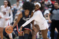 Connecticut's Christyn Williams steals the ball from Arkansas' Erynn Barnum, right, in the first half of an NCAA college basketball game, Sunday, Nov. 14, 2021, in Hartford, Conn. (AP Photo/Jessica Hill)