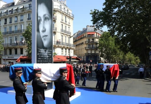 French Republican Guards carry the coffins of Holocaust survivor Simone Veil and her husband Antoine along a blue carpet leading to the Pantheon in Paris, their final resting place