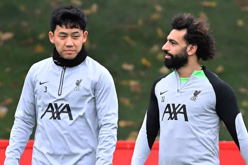 Wataru Endo and Mohamed Salah of Liverpool during a training session at AXA Training Centre