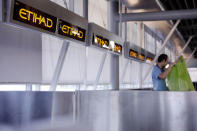 A worker cleans behind Etihad airlines counters at JFK International Airport in New York, U.S., March 21, 2017. REUTERS/Lucas Jackson