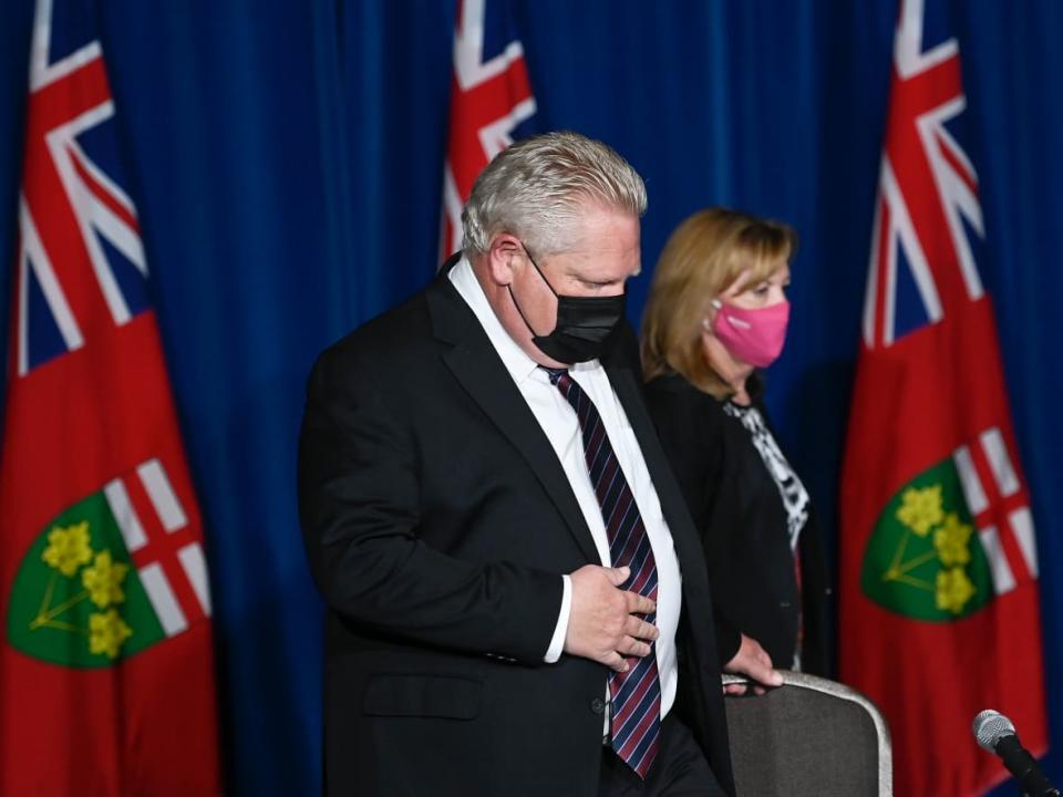 Ontario Premier Doug Ford, left, and Health Minister Christine Elliott Ontario arrive at a news conference in Toronto May 20, 2021. (Nathan Denette/Canadian Press - image credit)