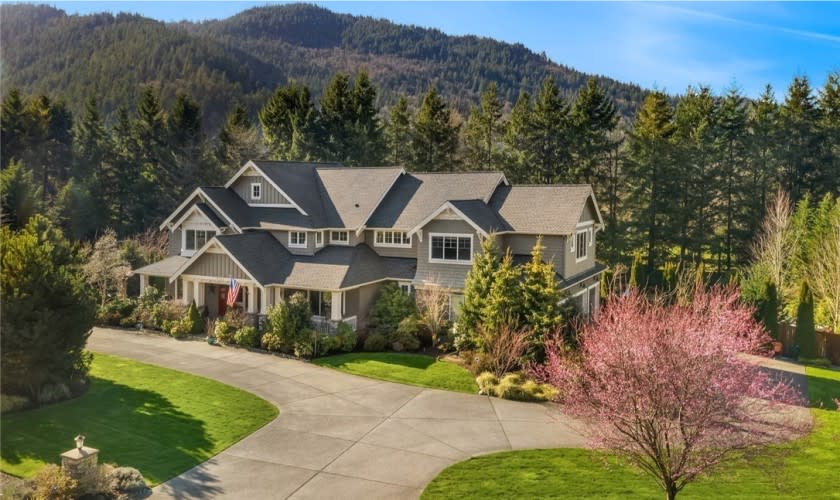 Set on a scenic acre, the two-story home holds five bedrooms and five bathrooms in just over 4,700 square feet.
