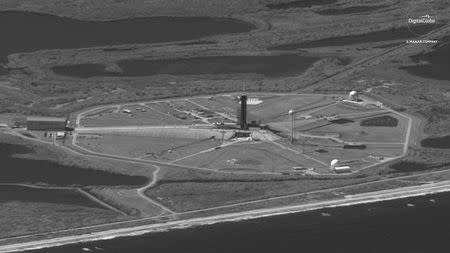 A SpaceX Falcon 9 rocket with the company's Crew Dragon spacecraft onboard at Launch Complex 39A is seen in this DigitalGlobe Satellite image at Cape Canaveral, Florida, U.S. on February 28, 2019. ©2019 DigitalGlobe, a Maxar company/Handout via REUTERS