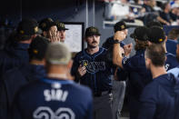 Tampa Bay Rays pitcher Tyler Alexander is congratulated after he left in the eighth inning of the team's baseball game against the Toronto Blue Jays on Friday, May 17, 2024, in Toronto. (Christopher Katsarov/The Canadian Press via AP)