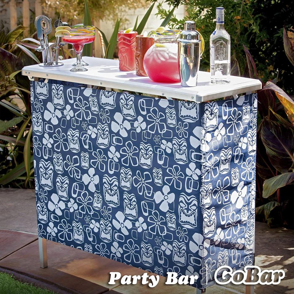 You can safely store water, beer, soda and other cocktail-ready beverages *and* have the perfect corner for making drinks on your deck or patio. <br /><br /><strong>Promising review:</strong> "Definitely a good buy! <strong>I love the portability and the storage shelf!</strong> The easy on/off covering provides an air of privacy. It sets up easy and holds its own! A very versatile year round serving &amp; entertaining tool! I love the carry case that comes with it!" &mdash; <a href="https://amzn.to/3tNpO52" target="_blank" rel="nofollow noopener noreferrer" data-skimlinks-tracking="5580838" data-vars-affiliate="Amazon" data-vars-href="https://www.amazon.com/gp/customer-reviews/R37JOZN01DD0EL?tag=bfgenevieve-20&amp;ascsubtag=5580838%2C8%2C33%2Cmobile_web%2C0%2C0%2C1159968" data-vars-keywords="cleaning" data-vars-link-id="1159968" data-vars-price="" data-vars-product-id="16176769" data-vars-retailers="Amazon">Amazon Customer</a><br /><br /><strong>Get it from Amazon for <a href="https://amzn.to/3gxTgs0" target="_blank" rel="nofollow noopener noreferrer" data-skimlinks-tracking="5580838" data-vars-affiliate="Amazon" data-vars-asin="B005DD6ZIU" data-vars-href="https://www.amazon.com/dp/B005DD6ZIU?tag=bfgenevieve-20&amp;ascsubtag=5580838%2C8%2C33%2Cmobile_web%2C0%2C0%2C1159982" data-vars-keywords="cleaning" data-vars-link-id="1159982" data-vars-price="" data-vars-product-id="13026251" data-vars-product-img="https://m.media-amazon.com/images/I/41m4e1HyM+L.jpg" data-vars-product-title="GoPong GoBar Portable High Top Party Bar, Includes 3 Skirt Designs and Carrying Case - Great for Parties, Tailgating and Trade Shows" data-vars-retailers="Amazon">$64.99</a>.</strong>