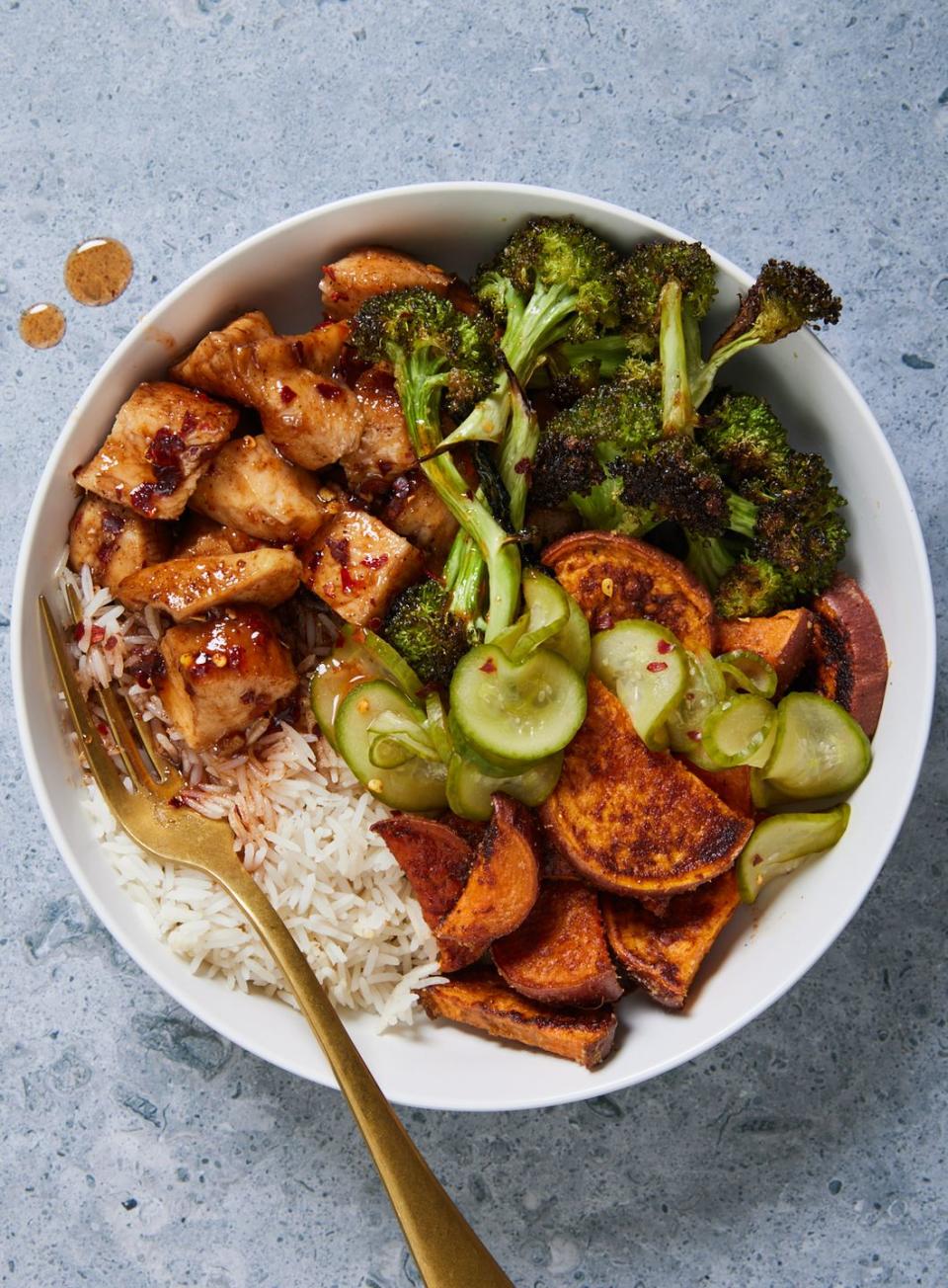 <p>If you're like us and put hot honey on <em>everything</em>, then this dinner is for you. Chicken is tossed in hot honey that you make yourself, so the heat level is completely up to you. We recommended drizzling any extra honey from the pan over the bowls for an added kick. 😎</p><p>Get the <strong><a href="https://www.delish.com/cooking/recipe-ideas/a40733793/hot-honey-chicken-and-rice-bowls-recipe/" rel="nofollow noopener" target="_blank" data-ylk="slk:Hot Honey Chicken & Rice Bowls recipe;elm:context_link;itc:0;sec:content-canvas" class="link ">Hot Honey Chicken & Rice Bowls recipe</a></strong>.</p>