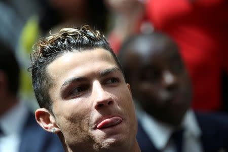 Real Madrid's Cristiano Ronaldo attends a ceremony after winning La Liga title at the headquarters of Madrid's regional government in Madrid, Spain, May 22, 2017. REUTERS/Susana Vera