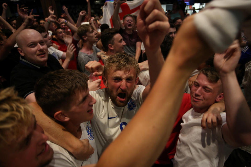 <p>Plenty of people ended up showering in beer after the tense shootout. (Picture: SWNS) </p>