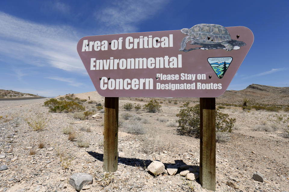 A Bureau of Land Management sign informs travelers along Highway 168, near Maopa, Nevada, to the habitat of the Mojave desert tortoise. (Photo: Mike Blake/Reuters)