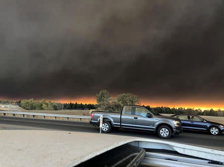 Vehicles are seen during evacuation from Paradise to Chico, in Butte County, California, U.S in this November 8, 2018 picture obtained from social media. @dlmadethecut/via REUTERS