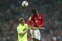 Football Soccer - Bayern Munich v FC Augsburg - German Cup (DFB Pokal) - Allianz Arena, Munich, Germany - 26/10/16 - Bayern's Kingsley Coman and Augsburg's Georg Teigl in action. REUTERS/Michael Dalder