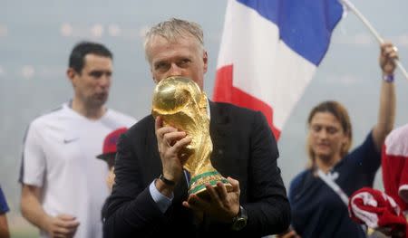 Soccer Football - World Cup - Final - France v Croatia - Luzhniki Stadium, Moscow, Russia - July 15, 2018 France coach Didier Deschamps celebrates with the trophy after winning the World Cup REUTERS/Carl Recine