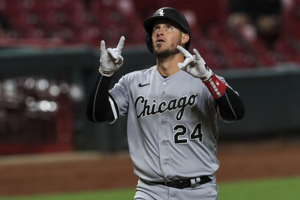 Chicago White Sox's Yasmani Grandal reacts after hitting a solo home run in the eighth inning during a baseball game against the Cincinnati Reds in Cincinnati, Saturday, Sept. 19, 2020. (AP Photo/Aaron Doster)