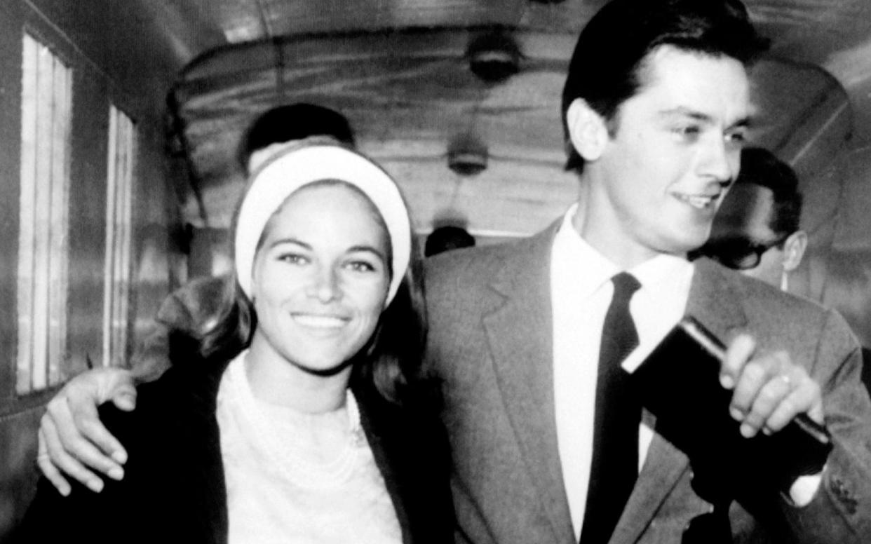 With Alain Delon boarding the ocean liner France after their wedding, August 1964 - AFP via Getty