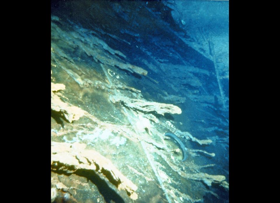 Large icicle-like structures hang from the side of the Titanic. 