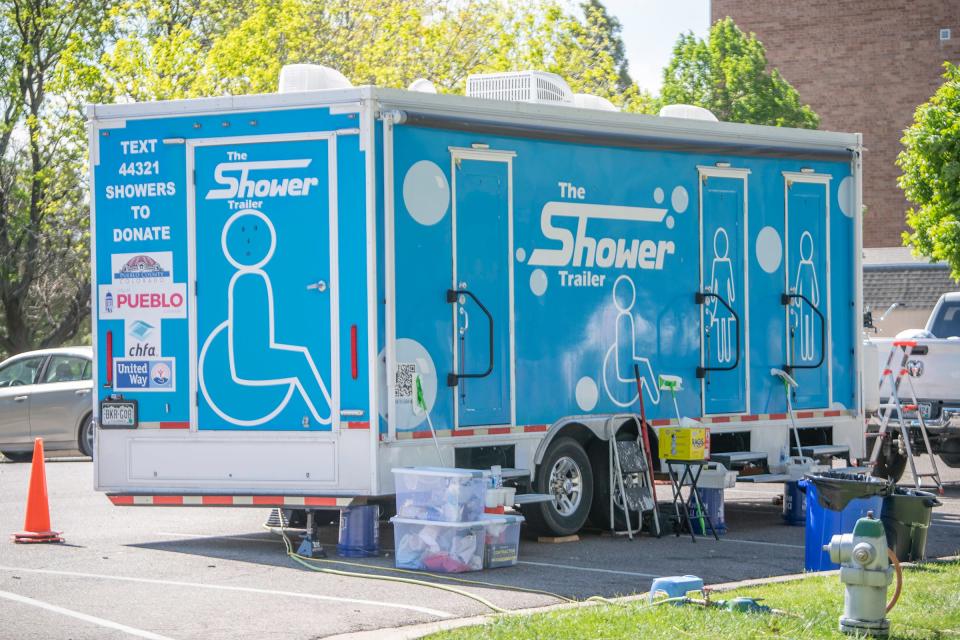 The Pueblo Cooperative Care Center's mobile shower unit sits at Mineral Palace Park during a ceremony celebrating the Mobile Shower Program on Wednesday, May 8, 2024.