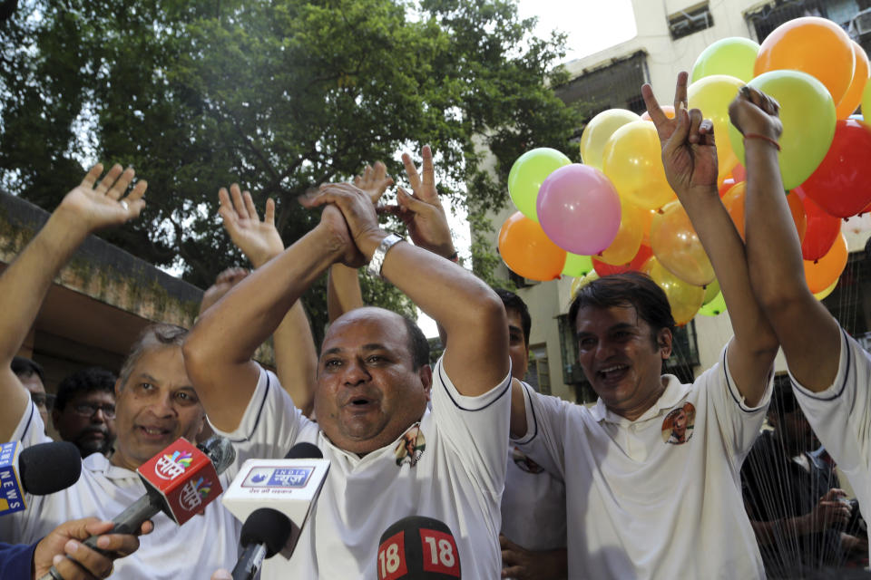 Indian friends of Kulbhushan Jadhav, celebrate verdict of International Court of Justice in Mumbai, India, Wednesday, July 17, 2019. The United Nations' highest court has ordered that Pakistan stay the execution of Jadhav, an alleged Indian spy and ordered that his case be reviewed after agreeing with India's contention that his rights had been violated. (AP Photo/Rajanish Kakade)