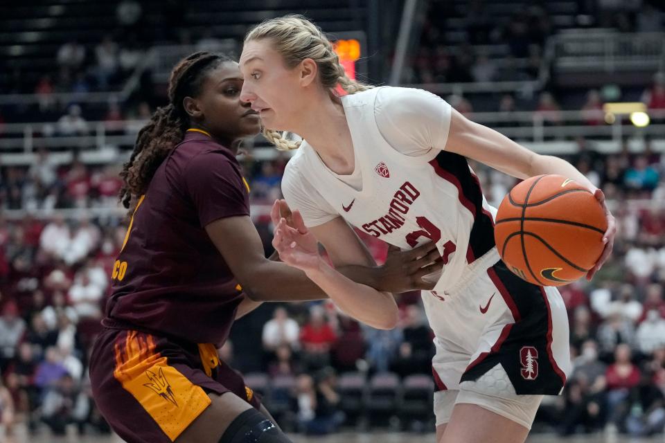 Stanford forward Cameron Brink, right, drives to the basket against Arizona State forward Sandra Magolico during the first half of the game in Stanford, California, Sunday, Feb. 25, 2024.