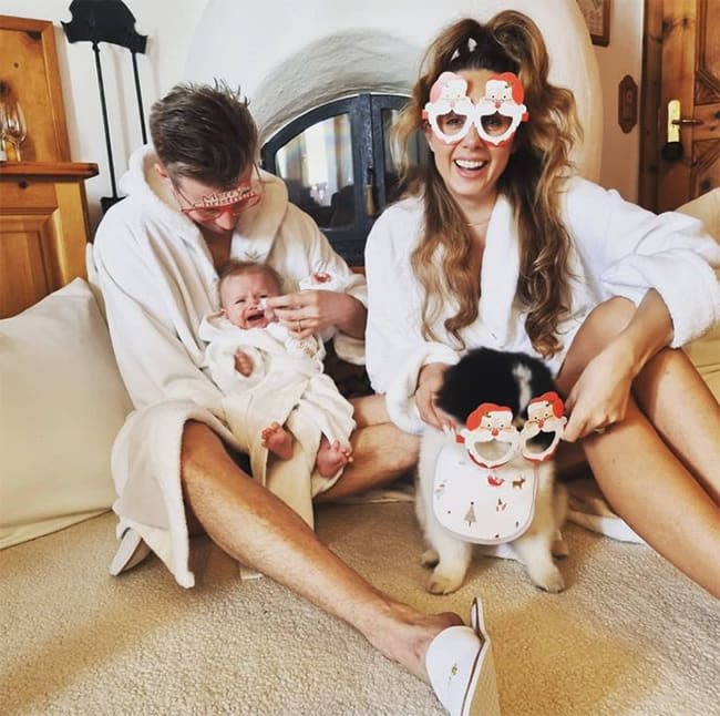 Nico Hulkenberg and wife with a baby and dog