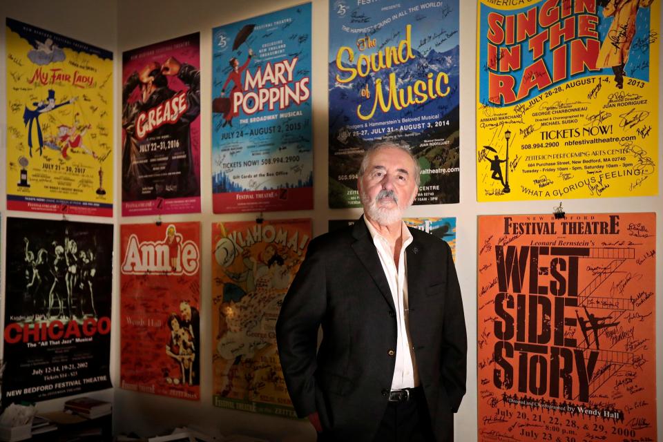 Long time New Bedford Festival Theatre Executive Producer, Armand Marchand, in front of some of the many shows he has produced over the course of his 30-year career.