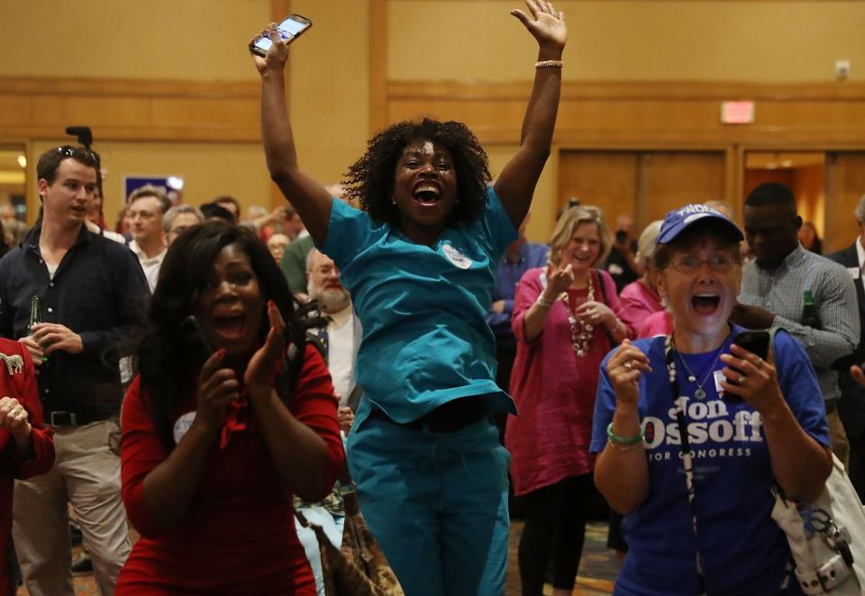 Erica Ferguson (C) and other supporters react as early return numbers show that Democratic candidate Jon Ossoff is in the early lead for Georgia’s 6th Congressional District in a special election to replace Tom Price, who is now the secretary of Health and Human Services on April 18, 2017 in Atlanta, Georgia. (Photo: Joe Raedle/Getty Images)