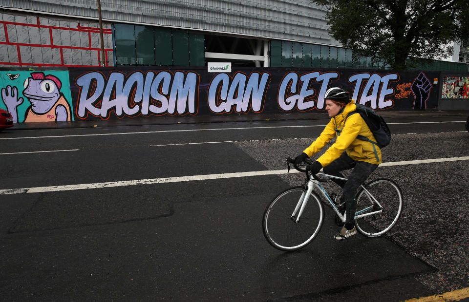 A cyclist passes graffiti in Edinburgh following a raft of Black Lives Matter protests took place across the UK over the weekend. The protests were sparked by the death of George Floyd, who was killed on May 25 while in police custody in the US city of Minneapolis.