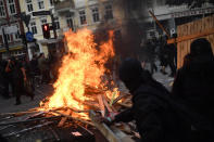 <p>Protesters burn barricades in the Schanze district during an anti-G20 march on July 7, 2017 in Hamburg, Germany. (Photo: Alexander Koerner/Getty Images) </p>