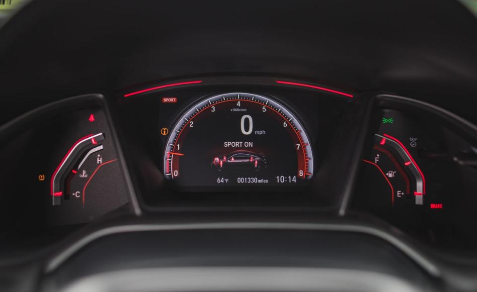 <p>The new Civic Si has a Sport button on its center console, just behind the shifter. Pressing this button calls up spicier accelerator mapping and a firmer setup for the (standard) electronically adaptive dampers.</p>